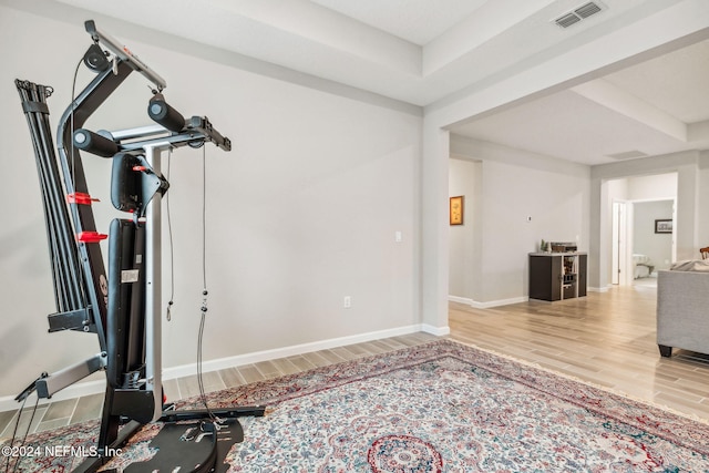 exercise area featuring hardwood / wood-style flooring