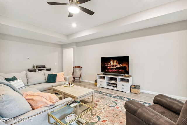 living room with hardwood / wood-style floors and ceiling fan