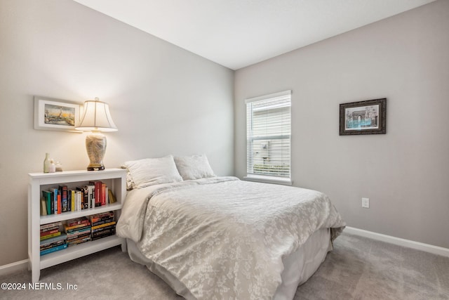 bedroom with light colored carpet