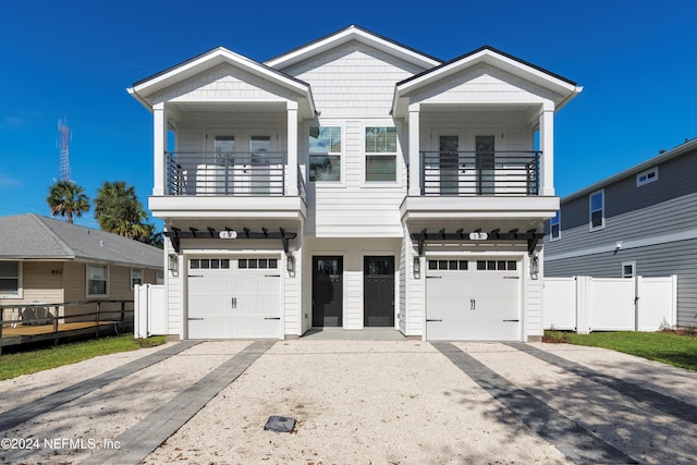 view of front of house with a balcony and a garage