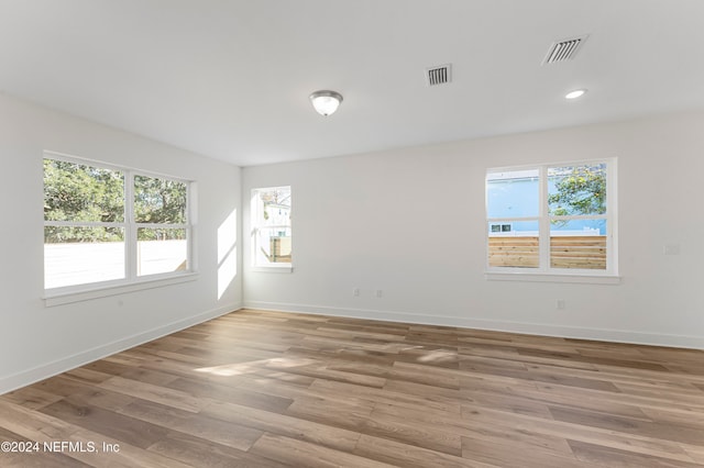 unfurnished room featuring light hardwood / wood-style flooring