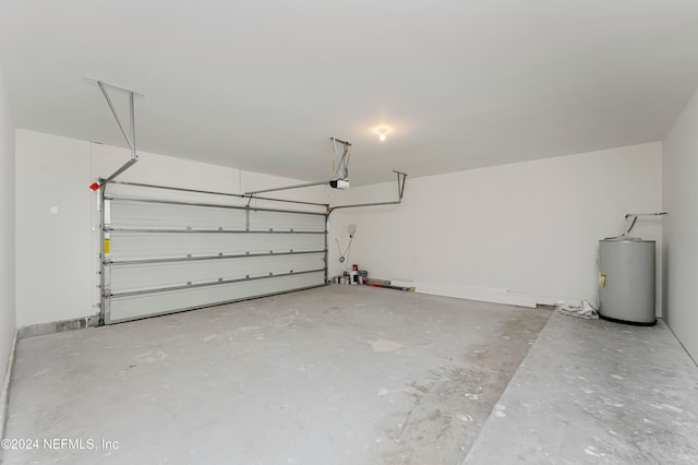 garage with electric water heater and a garage door opener