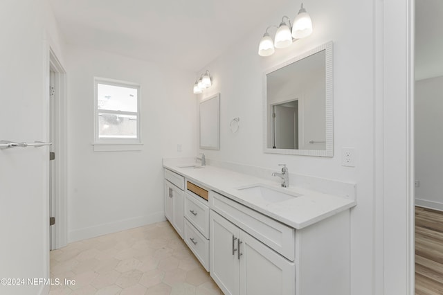 bathroom with tile patterned flooring and vanity