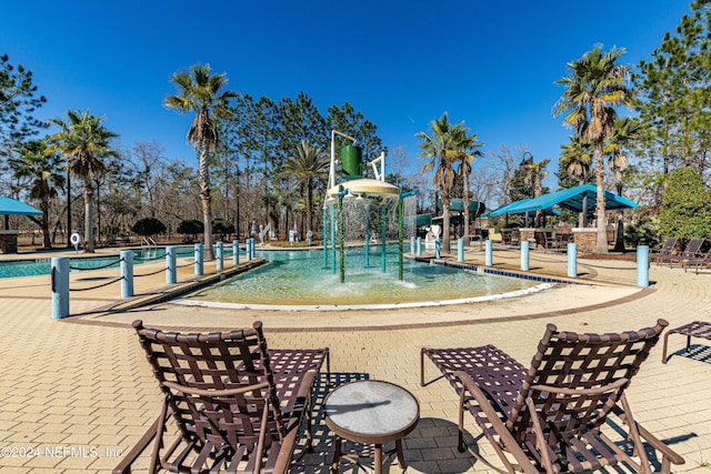 view of pool with pool water feature