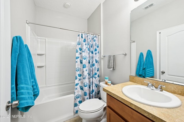 full bathroom featuring vanity, shower / bath combination with curtain, a textured ceiling, and toilet