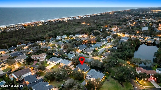 bird's eye view featuring a beach view and a water view