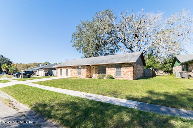 ranch-style house with a front lawn