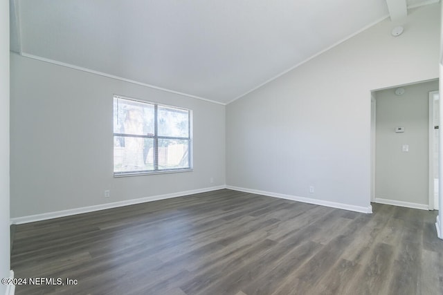 empty room featuring lofted ceiling with beams, crown molding, and dark wood-type flooring