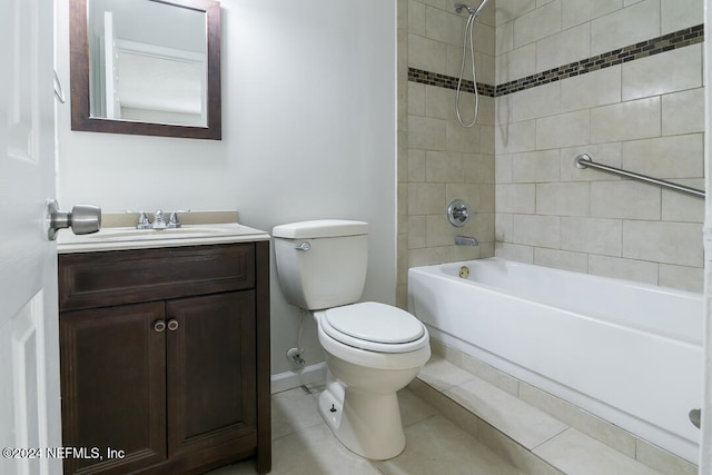 full bathroom with tile patterned floors, vanity, toilet, and tiled shower / bath combo