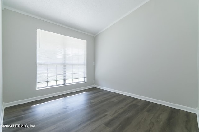 unfurnished room featuring a textured ceiling, dark hardwood / wood-style flooring, lofted ceiling, and crown molding