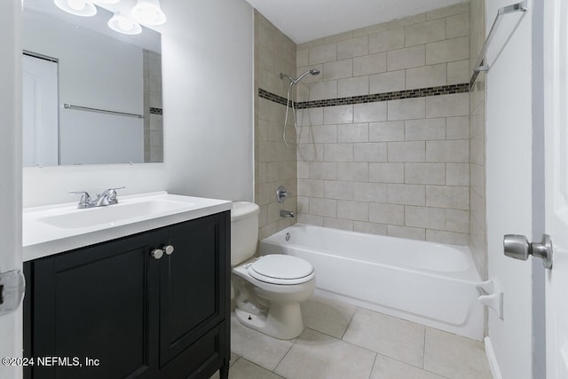 full bathroom featuring tile patterned flooring, tiled shower / bath combo, toilet, and vanity