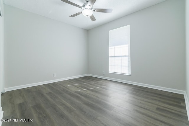 unfurnished room with ceiling fan and dark hardwood / wood-style floors