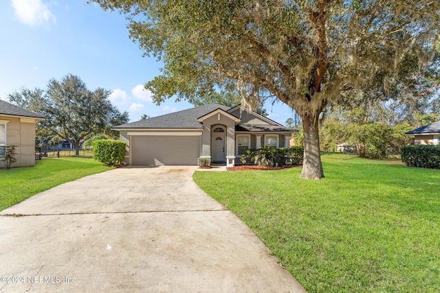 view of front facade featuring a front lawn and a garage