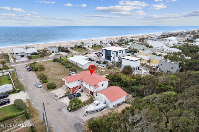 aerial view featuring a view of the beach and a water view