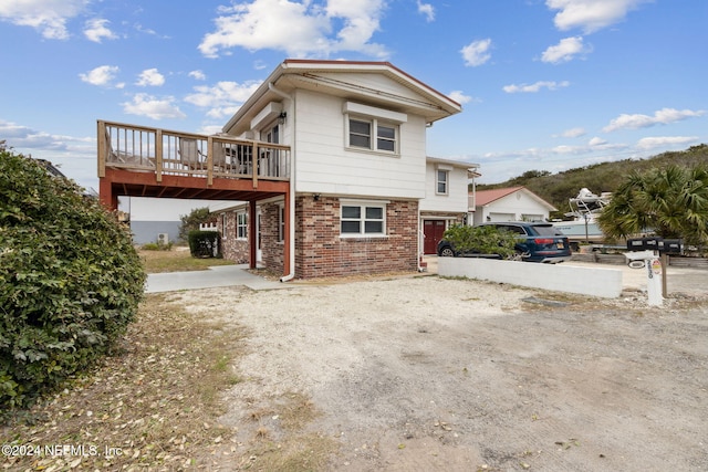 view of property exterior featuring a deck