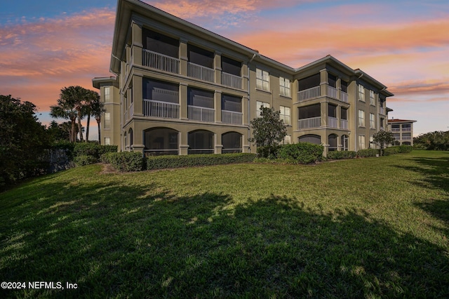 view of outdoor building at dusk