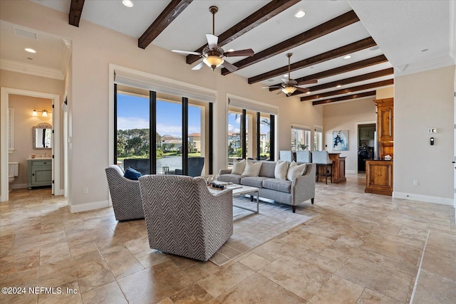 living room featuring ceiling fan, beamed ceiling, and crown molding