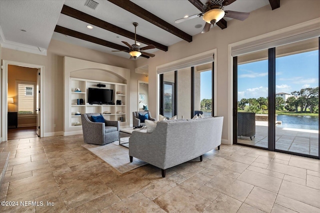 living room featuring ceiling fan, beam ceiling, and built in shelves