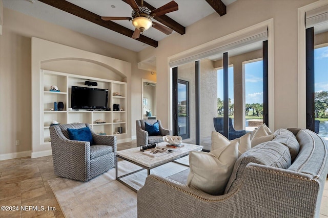 living room with ceiling fan, beam ceiling, and built in features