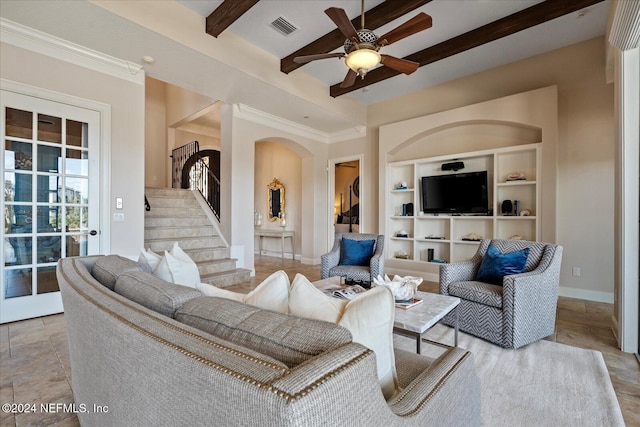 living room featuring ornamental molding, built in features, ceiling fan, and beam ceiling