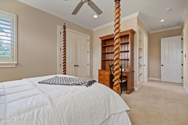 bedroom featuring a closet, ornamental molding, a textured ceiling, light colored carpet, and ceiling fan