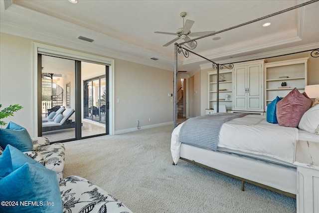 carpeted bedroom featuring ceiling fan, ornamental molding, a raised ceiling, and access to outside