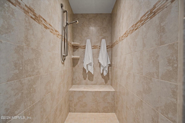 bathroom featuring tiled shower