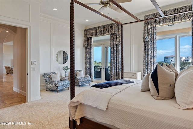 bedroom with ceiling fan, multiple windows, access to exterior, and ornamental molding