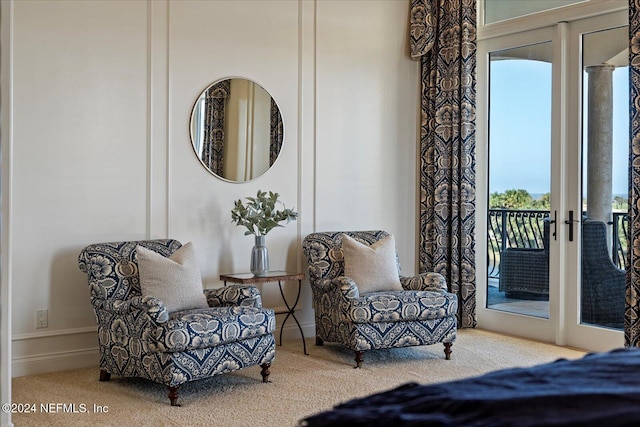 bedroom featuring french doors, access to outside, and carpet