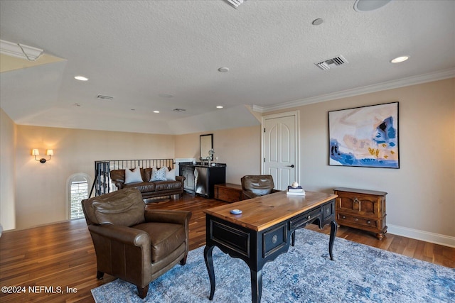 office space with wood-type flooring, a textured ceiling, and crown molding