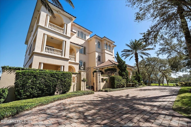 view of front of property with a balcony