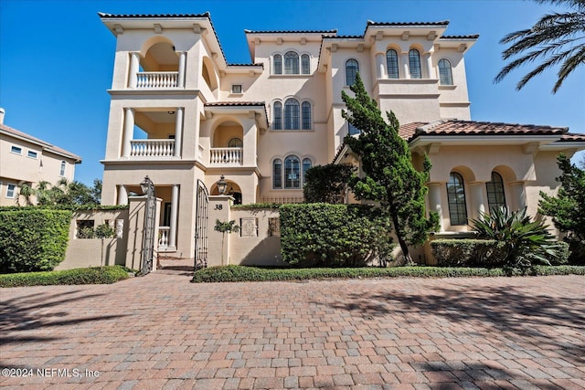 mediterranean / spanish home featuring a balcony