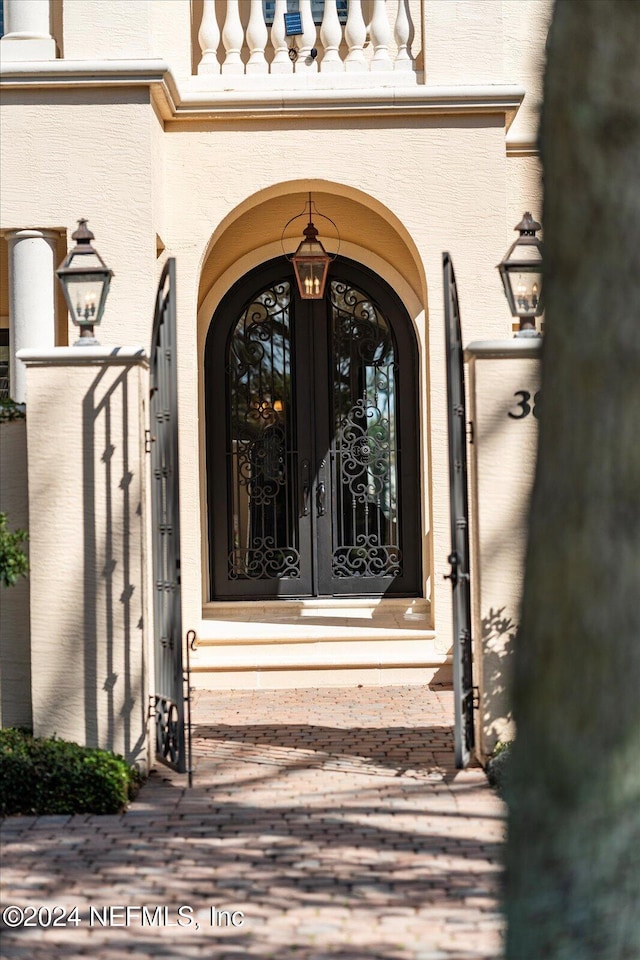 entrance to property featuring french doors