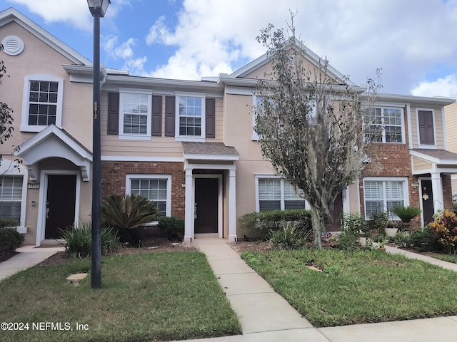 view of property with a front yard