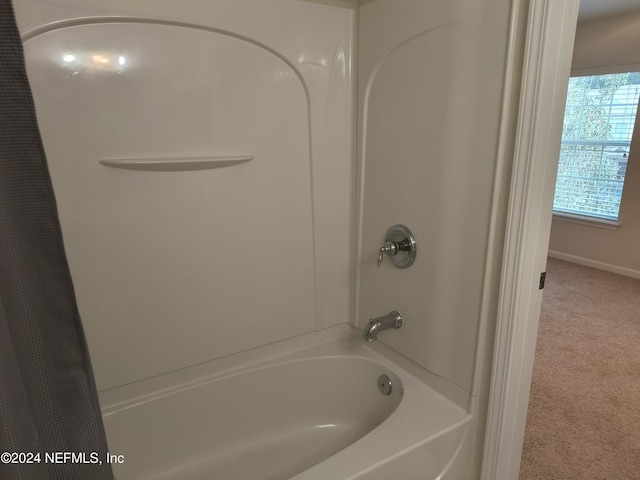 bathroom featuring shower / bath combination with curtain