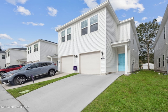 view of front of home featuring a garage and a front yard