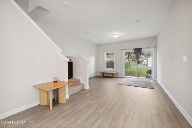 unfurnished living room with light hardwood / wood-style flooring