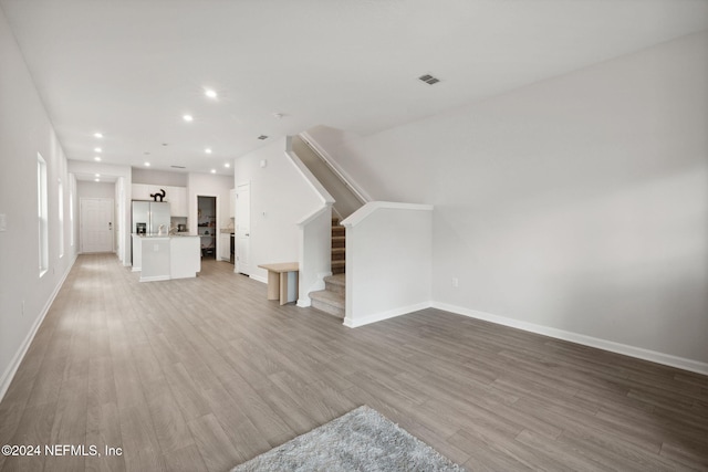 unfurnished living room with light wood-type flooring