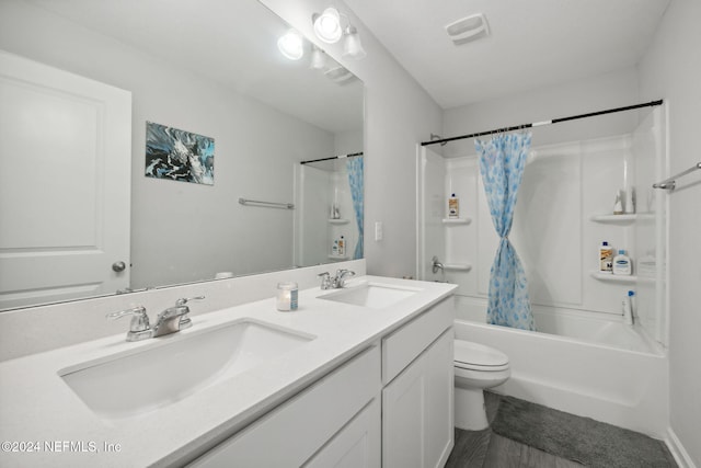 full bathroom featuring vanity, toilet, and shower / bathtub combination with curtain