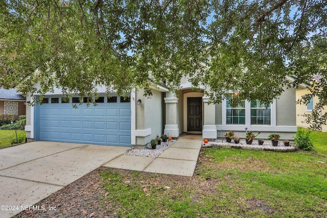 view of front of property featuring a garage