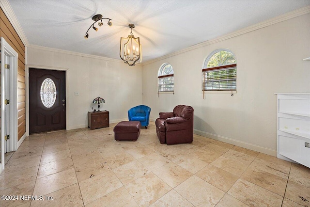 living area featuring crown molding and a notable chandelier