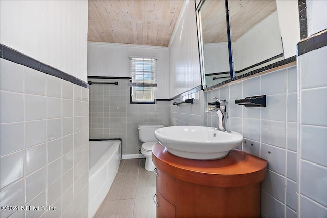 bathroom with a washtub, toilet, vanity, wood ceiling, and tile walls