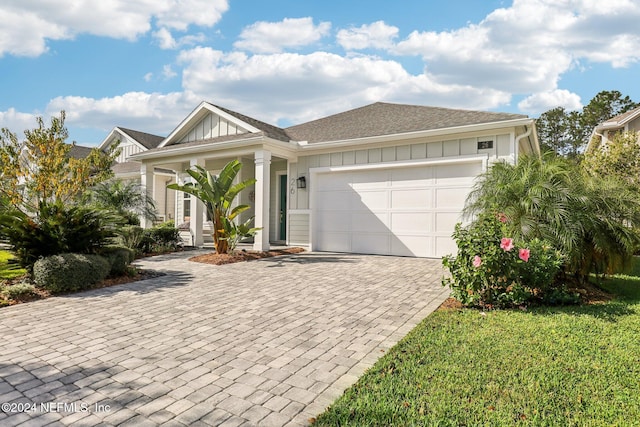 view of front facade with a front lawn and a garage