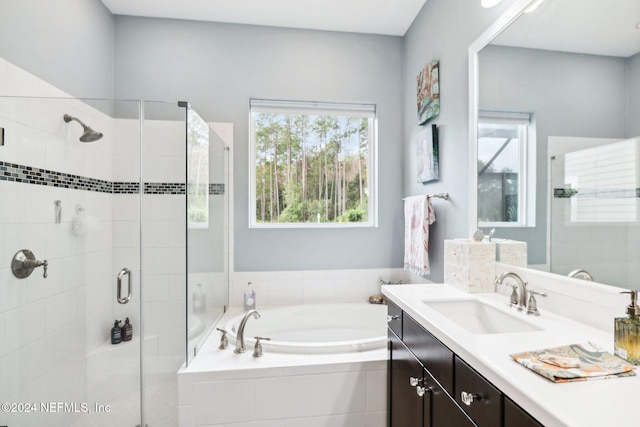 bathroom with vanity and plus walk in shower