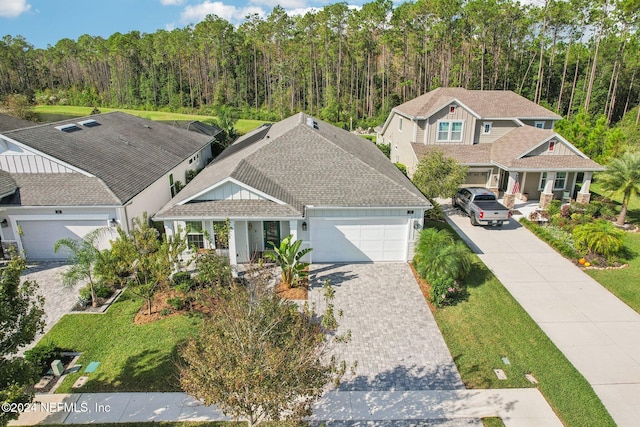 view of front of home featuring a garage and a front yard