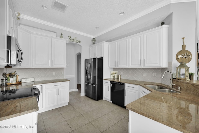 kitchen with a textured ceiling, sink, white cabinetry, and stainless steel appliances