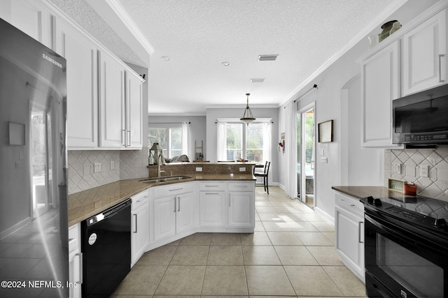 kitchen with kitchen peninsula, backsplash, crown molding, black appliances, and white cabinetry