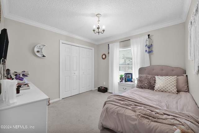 carpeted bedroom featuring crown molding, a closet, and a textured ceiling