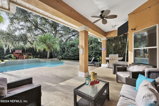 view of pool featuring area for grilling, a patio area, ceiling fan, and an outdoor hangout area