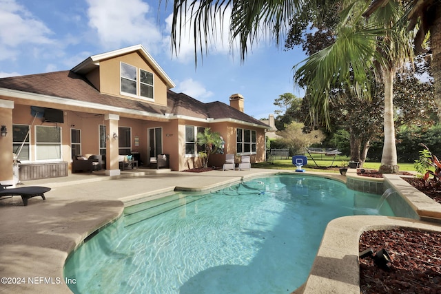 view of swimming pool featuring a patio